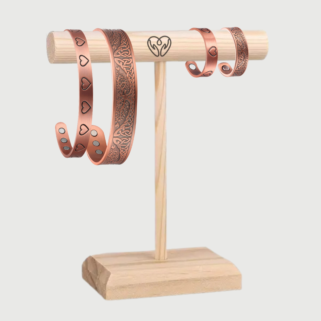 Pure Copper bracelets on a wooden stand with a white background