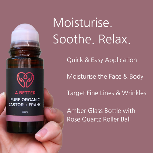 Hand holding a rollerball bottle with text about skincare benefits on a purple background