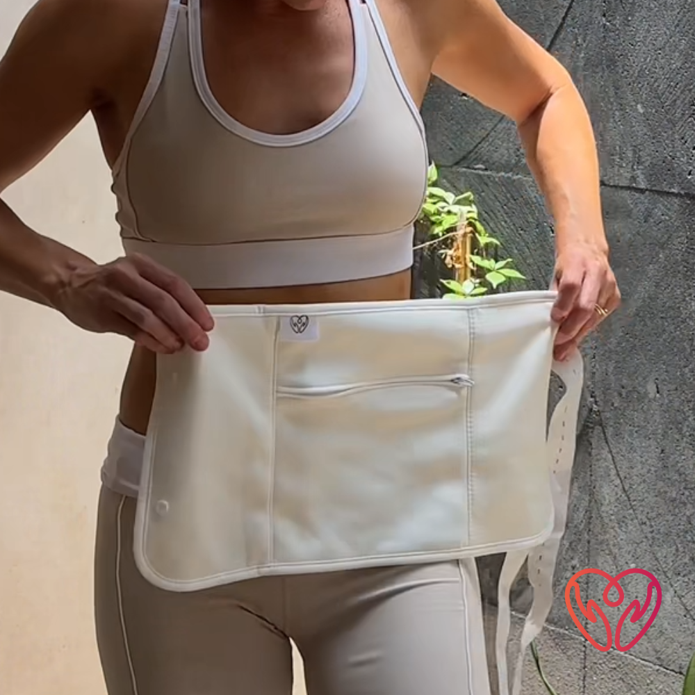 Woman in crop top and gym leggings holding the A Better cotton waist wrap white