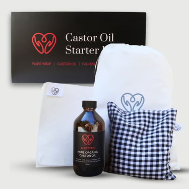 Castor oil starter kit with bottle, wraps, heat pack, and packaging on a white background