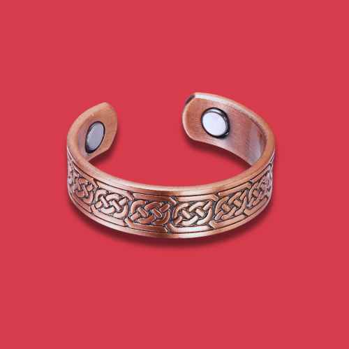 Copper bracelet with Celtic knot design on a red background